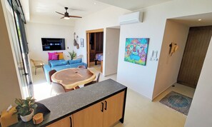 Spacious living area with wall of windows.