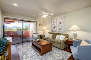 Coffee table has adjustable top and it on wheels.