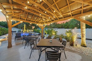 Comfy outdoor seating right by the pool - Brew a hot cup of coffee and start your morning off right in this perfectly tranquil spot!