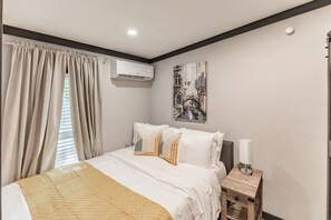 Cozy queen bed, black out curtains and your own TV in the room.