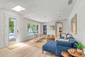 Living Room open to patio and Pool Access