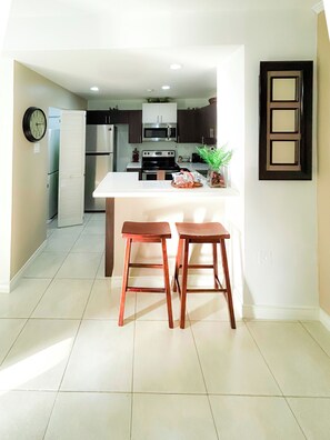 Kitchen with all essential appliances and utensils