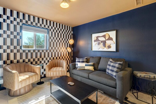 Sink into comfort and entertainment in our stylish living room, where a cozy sofa beckons you to relax and enjoy your favorite shows on the smart TV