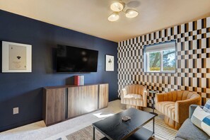 Unwind in style in our inviting living room, featuring a plush sofa perfectly positioned for relaxation