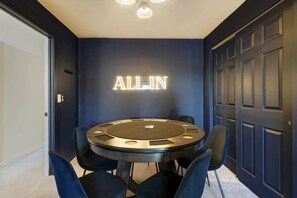 Ante up and indulge in some friendly competition in our game room! Our sleek poker table awaits your next thrilling hand. Ready to shuffle up and deal?