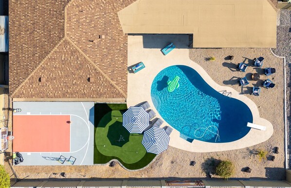 See our backyard from above, where fun and relaxation come together seamlessly