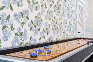 Challenge friends and family to endless fun on the sleek air hockey table.