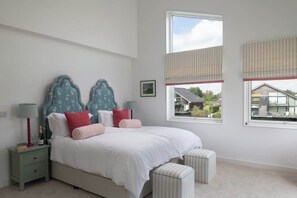 Large bedroom on first floor with large balcony with seating overlooking the lake.  Ensuite.  Can be made up as either one superking or two singles