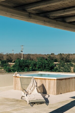 Rooftop jacuzzi with stunning views of the surrounding landscape.