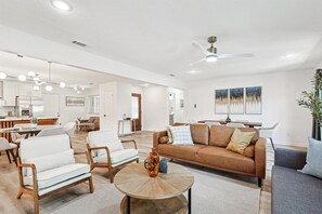 Featuring plenty of seating, an electric fireplace, and an HDTV, this living room is the perfect place to unwind and relax with your loved ones.