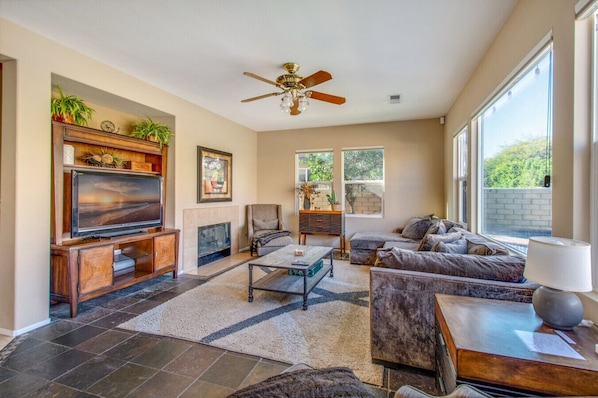 Living room with comfortable seating and a tv and fireplace