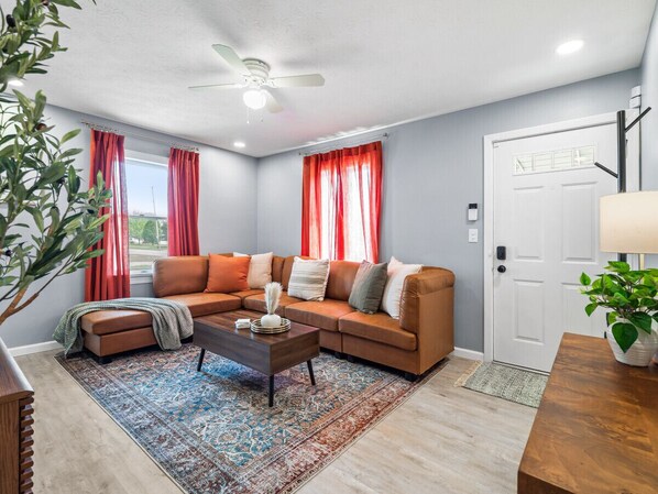 Relax on the large sectional couch, perfect for family gatherings.