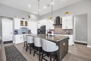 Beautiful, bright, open, fully equipped kitchen. Kitchen island seats 4