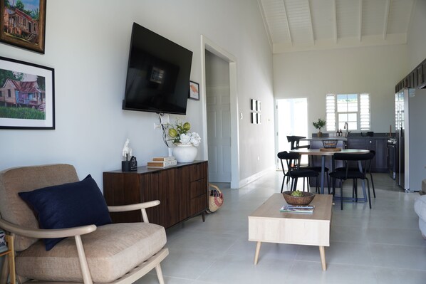 Spacious open-concept living with kitchen and dining area.