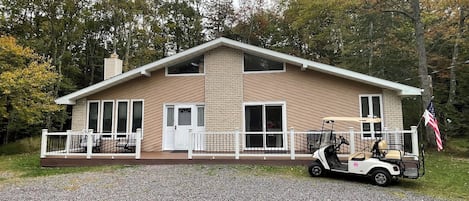 Single Home backs up to woods in rear and on left side.