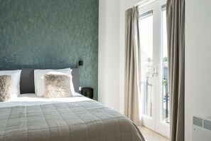 Indulge in a luxurious sleep experience with plush, soft bedding designed for your comfort and relaxation.