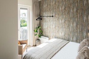 Experience the allure of historic architecture in our modern bedroom.