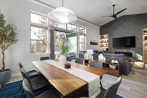 Gather around our inviting 8-person dining room table, perfect for intimate dinners and game nights. Additional seating is available for up to four in the kitchen bar area.