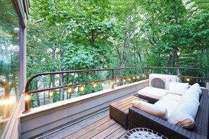 Private exterior living among the trees! Slopes out front in the Winter!