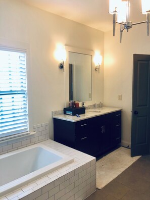Separate vanities across from one another. 