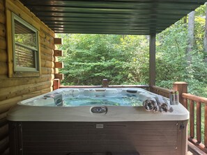Relax in the covered hot tub after a day of hiking