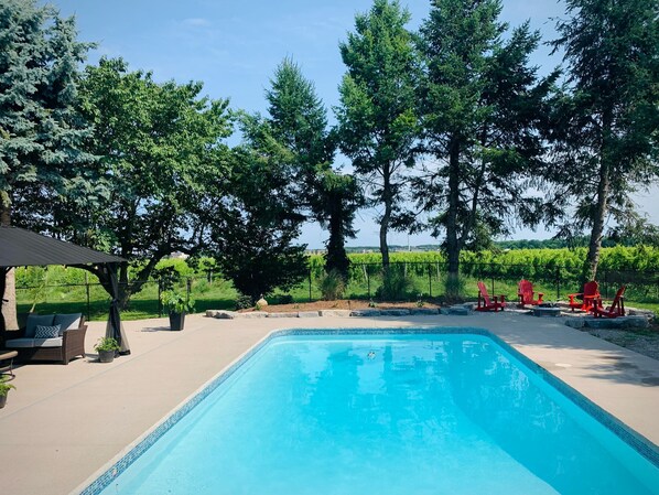 Fully private in-ground pool surrounded by vineyards.