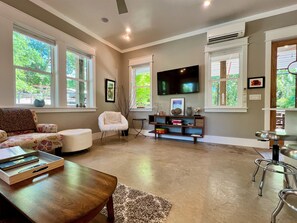 The living room and kitchen have a smart tv