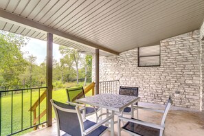 Covered Deck | Outdoor Dining Area | Partially Fenced Backyard