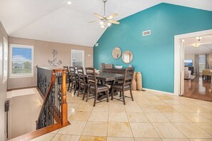 Dining table with six chairs and a bench.