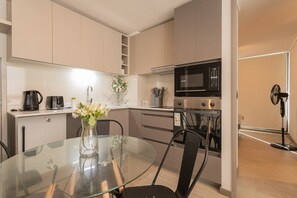 Sleek and modern kitchen with all essentials, perfect for culinary adventures and cozy dining experiences.