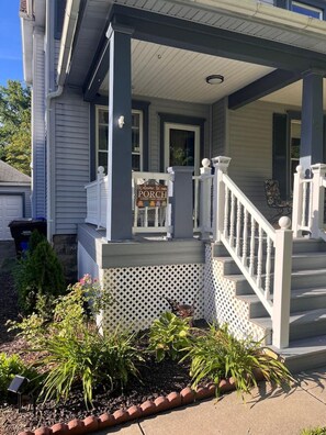 Several seating options to porch sit and enjoy this quaint neighborhood