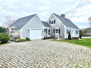 Waterfront home with cobblestone driveway. Up to 6 off-street parking spaces.