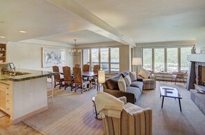 Entertain in the open-concept living area, offering a seamless flow between the kitchen, dining, and living spaces, perfect for gatherings.