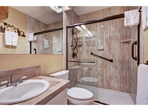 Refresh in the luxurious bathroom, complete with a spacious walk-in shower and modern fixtures to ensure a relaxing and rejuvenating experience.