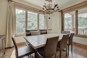 Dine in elegance in the dining room, featuring large windows that offer stunning views and plenty of natural light.