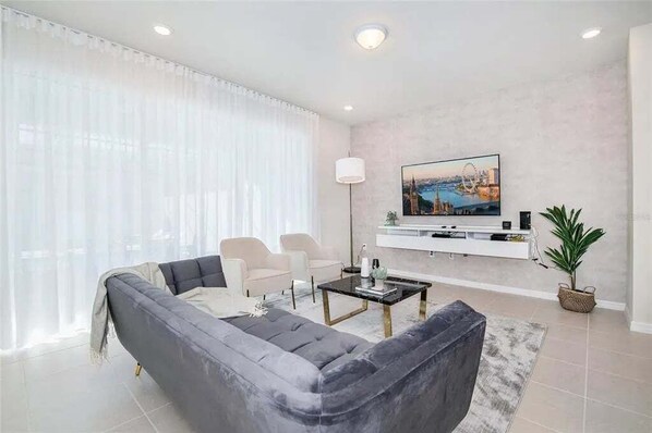 Modern lounge with chic décor, plush seating, and tons of natural light.