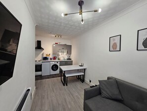 Fully equipped with modern appliances, including a stove, oven, fridge & freezer, and microwave. Spoons, plates, pots, and utensils are provided, so you can easily prepare your meals. Everything you need for a comfortable, home-like experience. You can also enjoy the convenience of a dining area for meals.