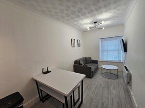 Whether you're watching TV, reading a book, or simply lounging, the living room offers a warm and homely vibe that makes it easy to settle in and feel at ease.