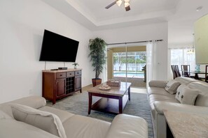Large sliding glass doors give you a lovely view of the pool and easy access to the private space at the back of the home.