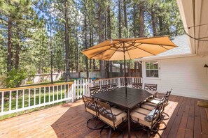 The home has a large deck where you can relax and enjoy the serene landscape.