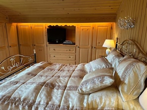 classy bedroom 1 with qeen sized bed 
