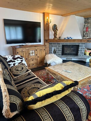 tv area with beautiful fire place in the living room