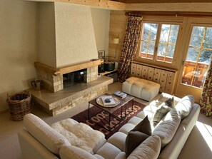 cozy living room in front of the fire place 