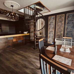 Dramatic spiral staircase leading to upstairs lounge