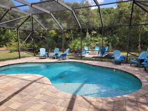 Secluded pool with screened enclosure