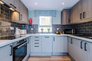 The fully equipped kitchen has everything you need for a short or long-term stay whilst away in Manchester.