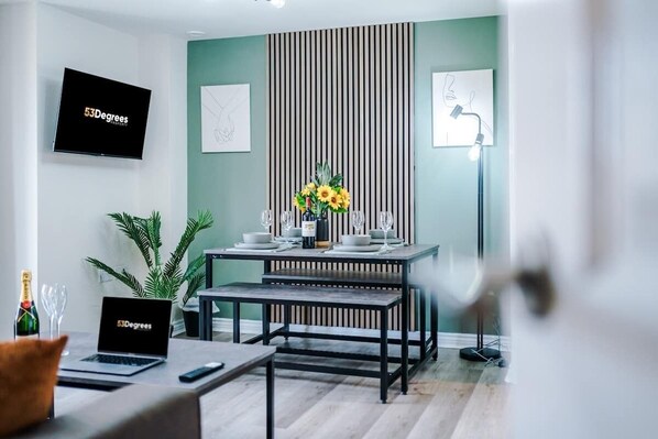 The open-plan living room, dining area and kitchen benefit from a comfortable double sofa-bed, 40-inch SMART TV on a movable bracket & dining table that can comfortably seat 6.