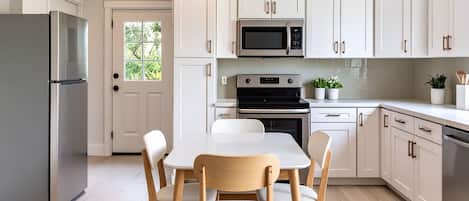 two dining tables, one seats for, the other 8 | digital preview of kitchen being renovated; final finishes may change