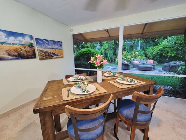 Imagine dining Al fresco on the covered, screened patio.