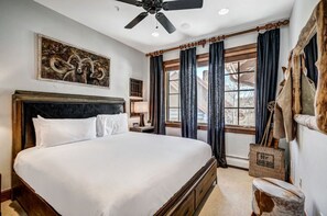 Sleep comfortably in our rustic bedroom, equipped with a luxurious king bed, ceiling fan, and charming decor. A perfect retreat for restful nights.